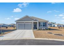 Curb appeal abounds in this charming craftsman style home with attached two-car garage at 1500 Oyster Bay Ct., Myrtle Beach, SC 29588