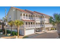 Three-story building with multiple units, each featuring private balconies and garages at 400 Hillside Dr. N # 302C, North Myrtle Beach, SC 29582