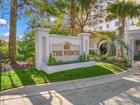 Elegant community sign, 'The Pointe' set against a lush green backdrop and clear blue sky at 9547 Edgerton Dr. # 904, Myrtle Beach, SC 29572