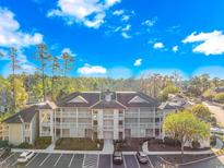 Attractive two-story building with ample parking and landscaping at 1551 Spinnaker Dr. # 5824, North Myrtle Beach, SC 29582