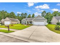 Charming single-story home with a well-manicured lawn and a two-car garage at 290 Georgia Mae Loop, Conway, SC 29527