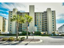 Oceanfront building with palm trees and ample parking at 3601 S Ocean Blvd. # 7-E, North Myrtle Beach, SC 29582