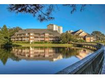 Exterior of building with pond and walkway at 410 Melrose Pl. # 219, Myrtle Beach, SC 29572