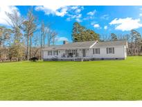 Ranch style home with spacious lawn and mature trees at 4106 Edwards Rd., Aynor, SC 29511