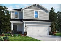 Charming two-story home with gray siding, a two-car garage, and manicured landscaping at 4807 Hopespring St., Myrtle Beach, SC 29579