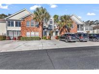 Brick front of townhome with parking and landscaping at 116 Brentwood Dr. # E, Murrells Inlet, SC 29576