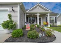 Charming single-Gathering home with a well-manicured front yard and inviting curb appeal at 141 Baylee Circle, Galivants Ferry, SC 29544