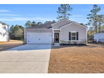 Charming craftsman style home with gray siding and a two-car garage at 152 Carolina Lakes Blvd., Myrtle Beach, SC 29588