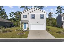Two-story house with light beige siding, a blue door, and a two-car garage at 219 Marauder Dr., Longs, SC 29568