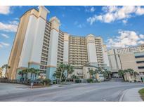 Oceanfront high-rise building with parking and tropical landscaping at 4800 S Ocean Blvd. # 1007, North Myrtle Beach, SC 29582