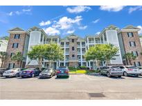Brick building exterior with parking and landscaping at 4882 Luster Leaf Circle # 202, Myrtle Beach, SC 29577