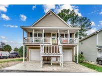 Two-story house with double garage and inviting front porch at 829 9Th Ave. S, North Myrtle Beach, SC 29582