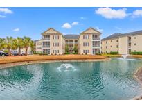 Beautiful condo community featuring manicured landscaping and a tranquil pond with a fountain at 2080 Cross Gate Blvd. # 303, Surfside Beach, SC 29575