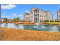 Condo building with pond and fountain in front at 2080 Cross Gate Blvd. # 303, Surfside Beach, SC 29575