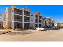 Two story apartment building with parking and balconies at 395 S Crow Creek Dr. # 1621, Calabash, NC 28467