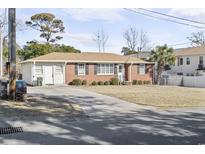 Brick ranch house with attached garage and yard at 408 S 16Th Ave. S, Myrtle Beach, SC 29577