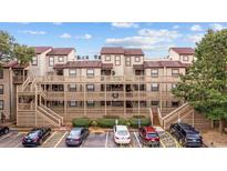 Three-story building with multiple balconies and parking at 501 Maison Dr. # F12, Myrtle Beach, SC 29572
