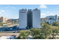 Holiday Towers building exterior, two-toned building with ocean view at 601 Mitchell Dr. # 1002, Myrtle Beach, SC 29577