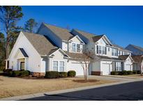 Two-story townhome with attached garage and landscaping at 6095 Catalina Dr. # 2611, North Myrtle Beach, SC 29582