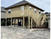 Elevated beach house with deck and stairs at 121 Marshland Ct., Myrtle Beach, SC 29572