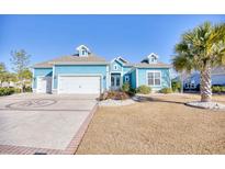 Charming coastal home with a two-car garage and landscaped lawn at 1305 Seabrook Plantation Way, North Myrtle Beach, SC 29582