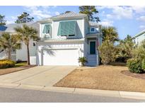 Charming two-story home with a white garage door and teal shutters at 301 Splendor Circle, Murrells Inlet, SC 29576