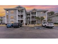 Well-maintained condo building with ample parking at 4761 Wild Iris Dr. # 103, Myrtle Beach, SC 29577