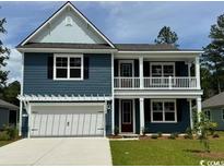 Charming two-story home with a welcoming front porch and a two car garage at 523 Slaty Dr., Myrtle Beach, SC 29588