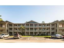 Three-story building with columns and ample parking at 562 Blue Stem Dr. # 54D, Pawleys Island, SC 29585