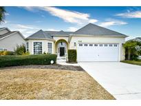 Attractive single-story house with a two-car garage and manicured lawn at 5703 Coquina Point Dr., North Myrtle Beach, SC 29582