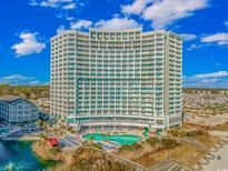 Oceanfront high-rise building with pool and boardwalk at 161 Seawatch Dr. # 1017, Myrtle Beach, SC 29572