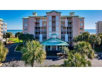 Oceanfront building with multiple levels and balconies at 195 S Dunes Dr. # 204, Pawleys Island, SC 29585