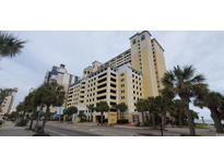 Elegant high-rise building with ocean views and palm trees at 2000 N Ocean Blvd. # 1206, Myrtle Beach, SC 29577