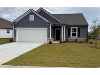 Charming single-Gathering home with two-car garage, landscaped yard, and inviting curb appeal at 272 Hawks Run Dr., Calabash, NC 28467