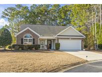 Brick and shingle ranch home with attached garage and landscaped yard at 3169 Shorecrest Bay Dr., Murrells Inlet, SC 29576