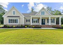 Charming single-Gathering home with a inviting front porch, manicured lawn and blue shutters at 3220 Highway 19, Conway, SC 29526