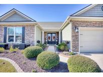 Inviting curb appeal featuring stone and siding accents at 5241 Casentino Ct., Myrtle Beach, SC 29579