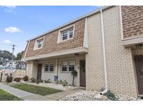 Inviting townhome showcasing brick and siding, complemented by tasteful landscaping and a cozy, welcoming facade at 5508 Porcher Dr. # 4, Myrtle Beach, SC 29577