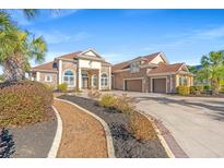 Brick home with three-car garage and landscaped yard at 8010 Wacobee Dr., Myrtle Beach, SC 29579