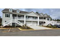 Two-story townhome with attached garage and front porch at 1143 Freeboard St. # 203, Murrells Inlet, SC 29576