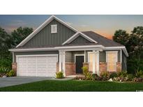 Two-story home with gray siding, brick accents, and a two-car garage at 1312 Winding Creek Way, Myrtle Beach, SC 29588