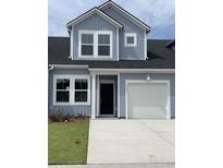 Two-story house with gray siding, white trim, and a two-car garage at 165 Hoffman Park Dr. # 76, Myrtle Beach, SC 29588