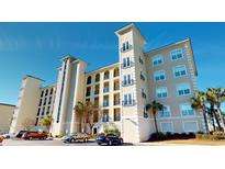 Elegant condo building with classic architecture, balconies, and well-maintained landscaping and ample parking at 257 Venice Way # H 204, Myrtle Beach, SC 29577