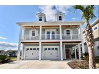 Two-story house with double garage and front porch at 406 Harbour View Dr., Myrtle Beach, SC 29579