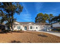 Newly constructed home with a two-car garage and well-manicured lawn at 410 Rosemary St., Georgetown, SC 29440