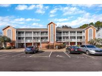 Inviting condo building with ample parking and landscaping at 4850 Meadowsweet Dr. # 1711, Myrtle Beach, SC 29579