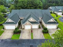 Attractive three-unit building with a green roof and two-car garages at 663 Pinehurst Dr. # 93C, Pawleys Island, SC 29585