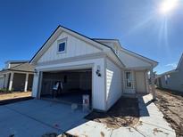 Two-story craftsman style home with attached garage and landscaping at 1273 Lady Bird Way, North Myrtle Beach, SC 29582