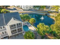 Aerial view of a beach town home with private pool and pond at 209 Hillside Dr. N # 204, North Myrtle Beach, SC 29582