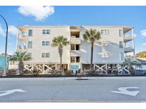 Three-story building with palm trees and ocean views at 3610 S Ocean Blvd. # 316, North Myrtle Beach, SC 29582